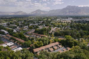 Aerial view of property's location with mountains and nearby suburban area