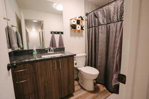 Full bathroom featuring vanity and light wood finished floors