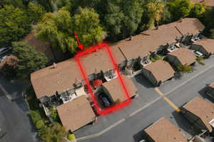 Aerial view of residential area featuring property boundaries highlighted