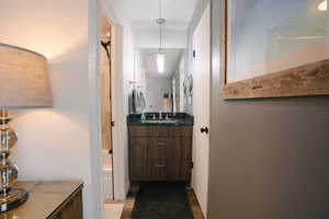 Bathroom with vanity and dark wood-type flooring