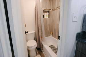 Full bathroom with shower / bath combo and vanity