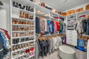 Walk in closet featuring carpet flooring