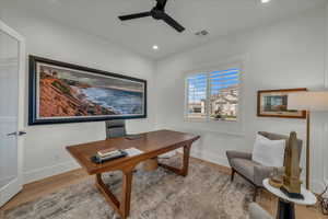 Home office featuring light wood finished floors, recessed lighting, and a ceiling fan