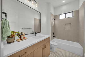 Full bathroom with shower / tub combination and vanity