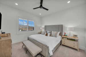 Bedroom featuring a ceiling fan, recessed lighting, and light colored carpet
