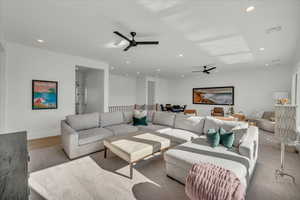 Living area featuring recessed lighting, wood finished floors, and ceiling fan
