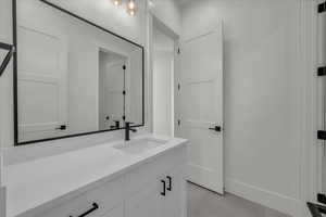 Bathroom with vanity and light tile patterned floors