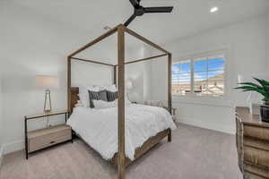 Bedroom featuring light carpet, a ceiling fan, and recessed lighting