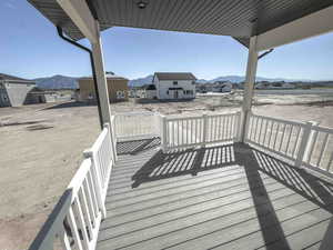 Wooden terrace with a mountain view and a residential view