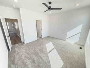 Unfurnished bedroom featuring recessed lighting, carpet floors, and a ceiling fan