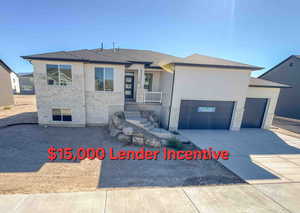 View of front of home featuring stone siding, an attached garage, roof with shingles, and driveway