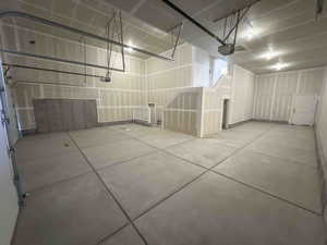 Garage featuring a garage door opener