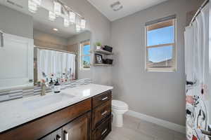 Bathroom featuring vanity and a shower with curtain
