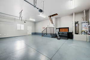 3-car garage with expoxy flooring, 10x10 attic space with lighting