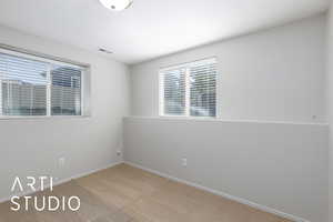 Carpeted empty room featuring baseboards
