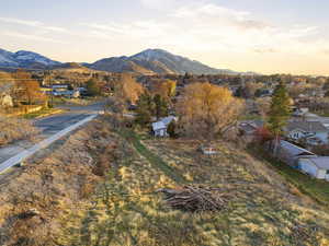 View of mountain backdrop featuring nearby suburban area