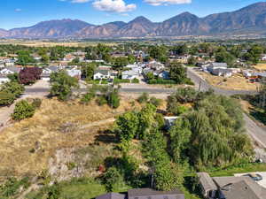 Aerial view of residential area featuring a mountainous background