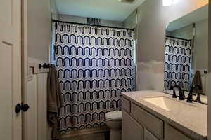 Bathroom with vanity and a shower with curtain