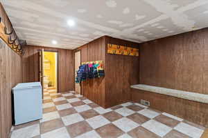 Basement entry looking to the bathroom and utility room. * small freezer