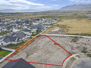 Aerial perspective of suburban area featuring mountains and property boundaries highlighted