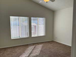 Master Bedroom with large windows and vaulted ceiling