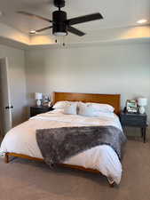 Carpeted bedroom with ceiling fan, recessed lighting, and a textured ceiling