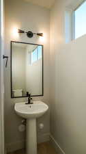 Bathroom featuring wood finished floors and baseboards