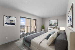 Large master bedroom with mountain views and balcony