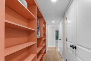 Hallway with bookcase and adjustable shelving