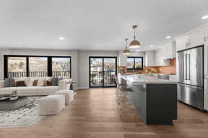 Living room and kitchen are flooded with natural light!