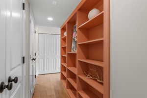 Hallway with bookcase and adjustable shelving