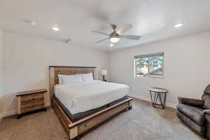 Carpeted bedroom with attic access, ceiling fan, recessed lighting, and a textured ceiling