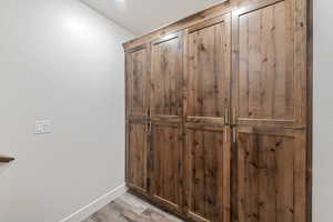 Detailed view of baseboards and wood finished floors