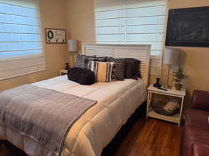 Bedroom with wood finished floors