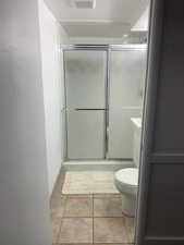 Full bathroom featuring a stall shower and vanity