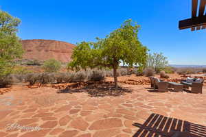 View of patio featuring a mountain view and an outdoor living space