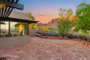 Patio terrace at dusk with a patio and a mountain view