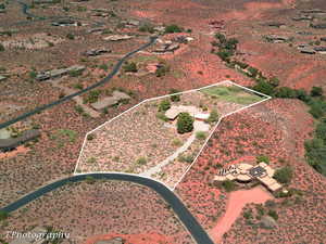 Aerial view of sparsely populated area featuring a desert landscape and property parcel outlined