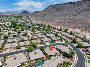 Aerial perspective of suburban area with a mountainous background