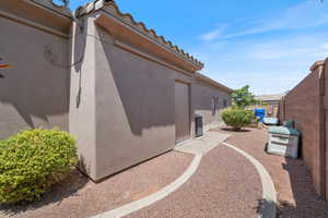 View of home's exterior with a tile roof and stucco siding