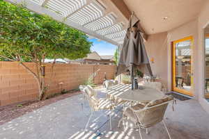 View of patio with a pergola and outdoor dining area