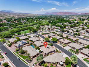 Aerial perspective of suburban area with a mountain backdrop
