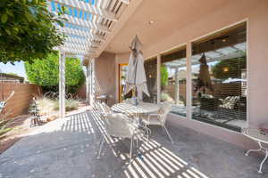 View of patio featuring a pergola and outdoor dining area