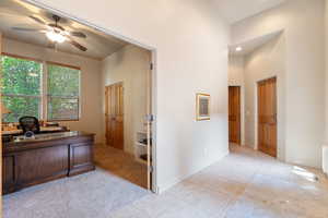 Office area featuring light carpet, light tile patterned floors, a ceiling fan, and recessed lighting