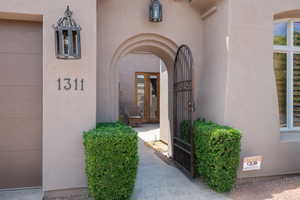 Property entrance with stucco siding