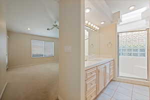 Full bath with a stall shower, vanity, a ceiling fan, recessed lighting, and light tile patterned floors