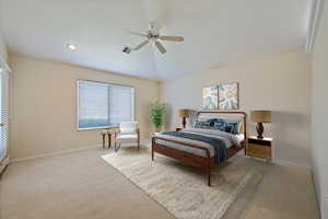 Bedroom featuring light colored carpet, a ceiling fan, and a textured ceiling