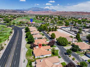 Aerial view of residential area featuring a mountainous background