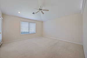 Unfurnished room with light carpet, ceiling fan, and a textured ceiling