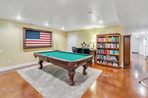 Playroom with pool table, recessed lighting, and finished concrete floors